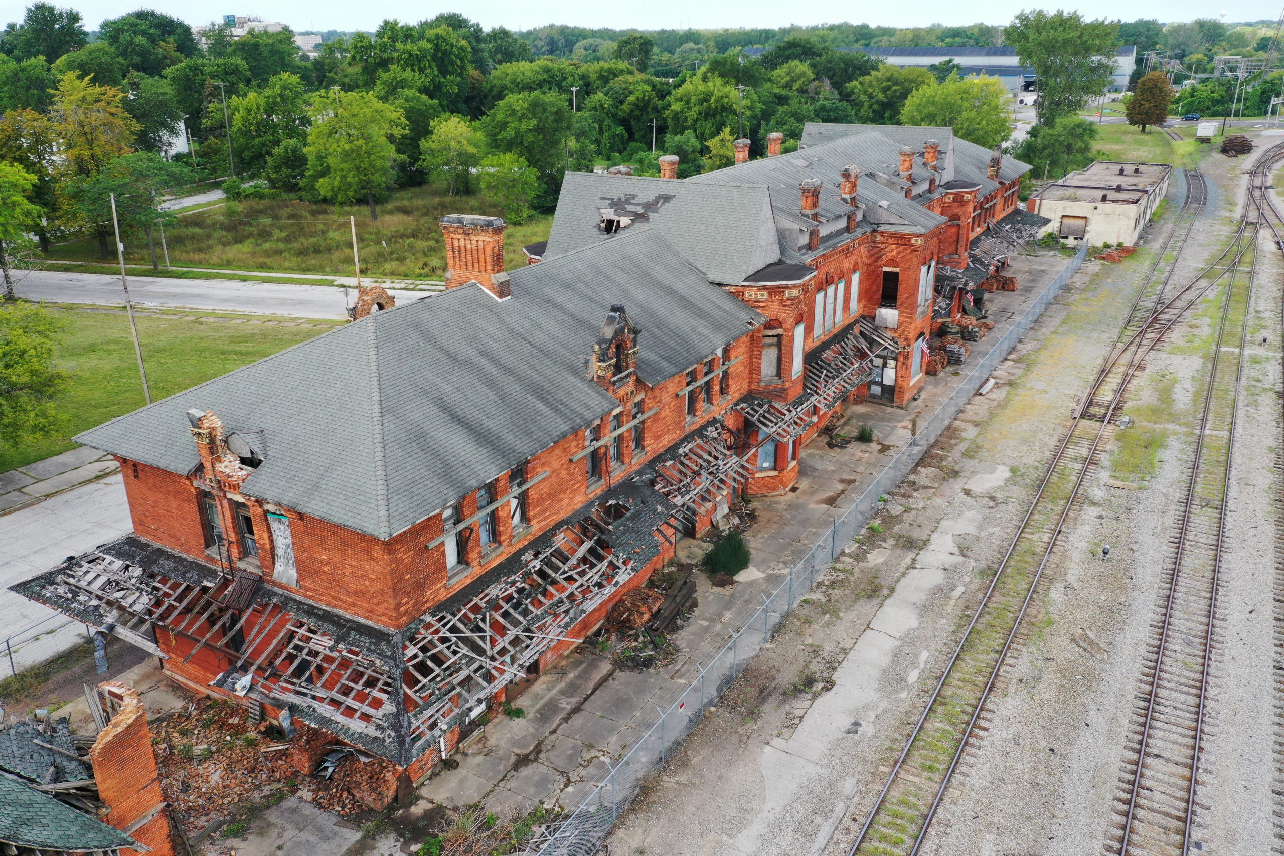 An aerial view of Potter Street Station facing the back of the building with the railroad tracks.